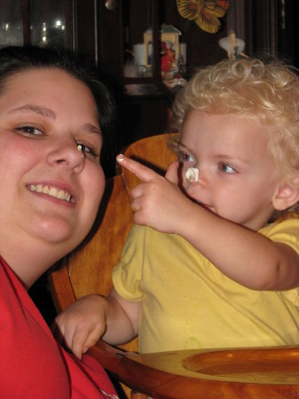 Cailey putting icing on Michele's nose.