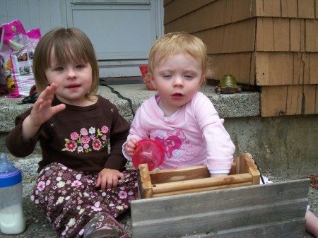 Nevaeh & Mikaylah filling Bird Feeders