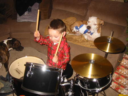 Grandson Aidan with his new drumset