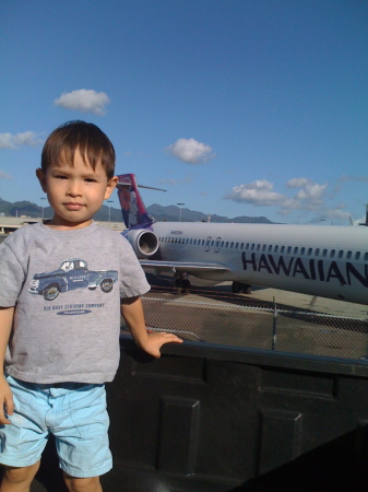 At the airport watching planes takeoff.