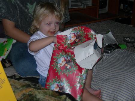 Opening her present from Gran & Gumpa