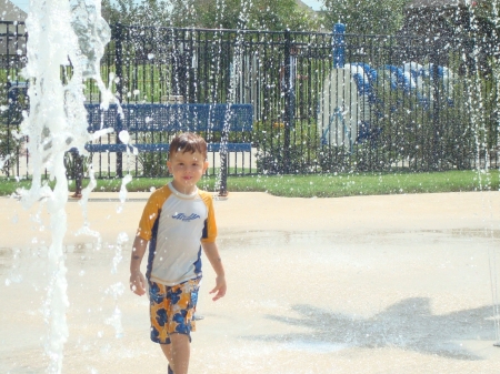 Chase at the Splash pad in our neighborhood