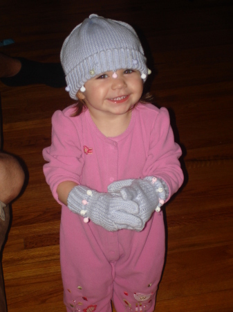 Jolie trying on sisters hat and gloves