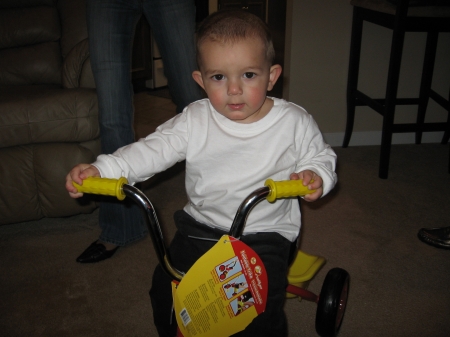aiden on his new tricycle