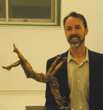 with my sculpture in an exhibition