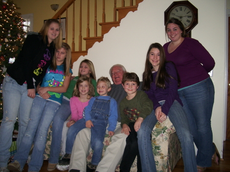 Jim with our 8 grandchildren