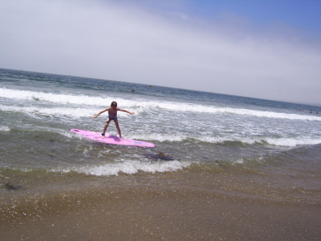 Emma surfing at Rat beach