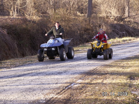 Quinn & Daddy riding their 4 wheelers