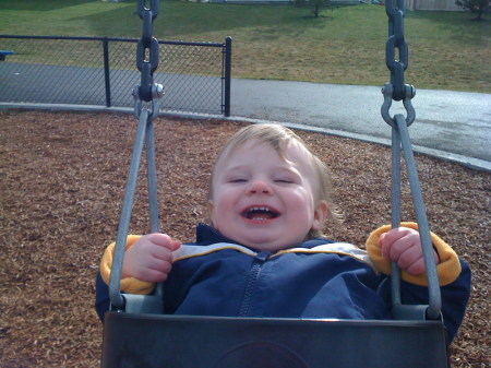 Aaron LOVES the swings!