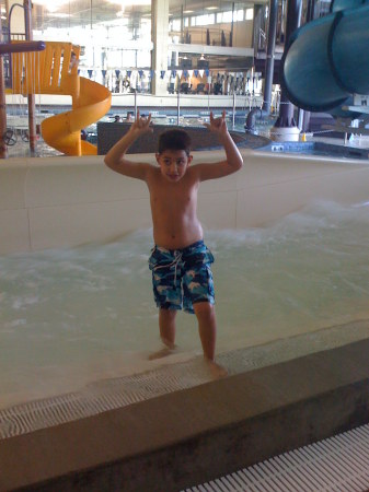 Alan getting his slide on at the water park.