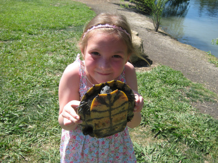 Our granddaughter, Grace, with a turtle