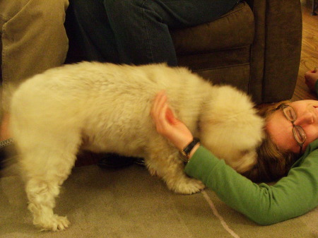 Liza, our aged cockapoo, nuzzling Jill