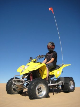 My son Cain on his quad at the dunes