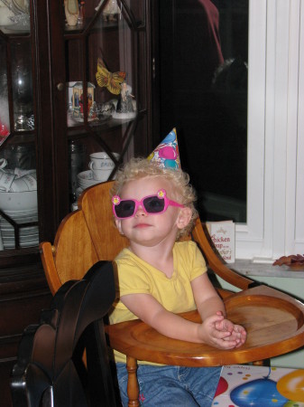 Trying on her sunglasses for her party..