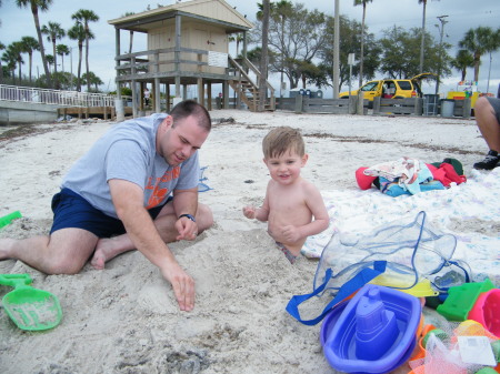 Michael buries Robert in the sand