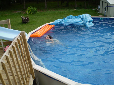 My daughter Hannah in our pool