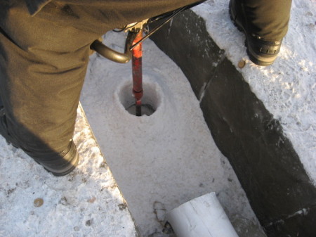 Drilling thru the ice