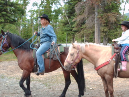 Dy and Cheyenne leading a student rider