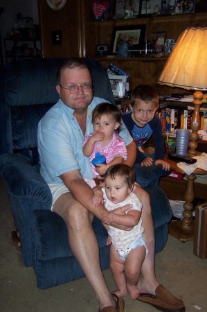 Husband Jim with all three grandchildren