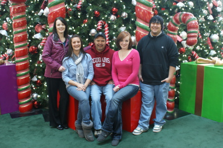 The family in front of the tree at Riverpark Square