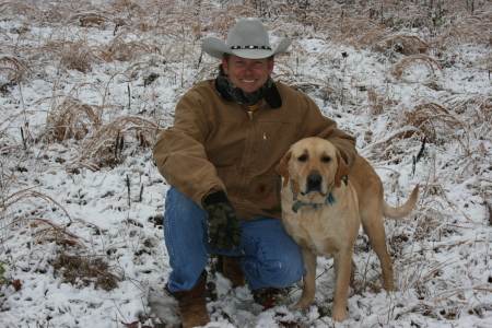 My husband Matt with our yellow lab, Magnum