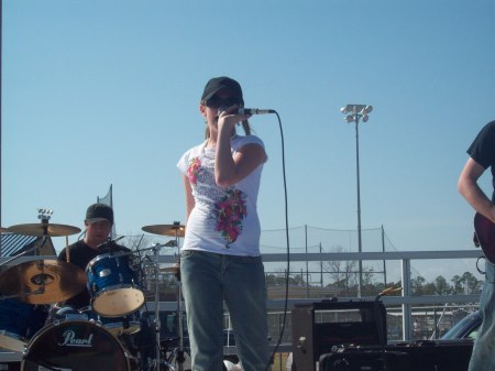 Kayla singing with the band.