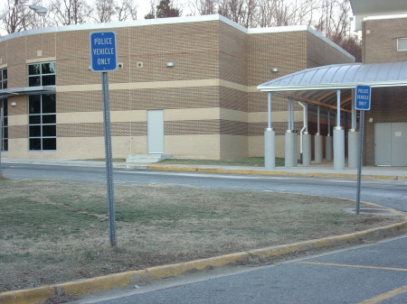 "Police Vehicle Only" - TWO parking spots.