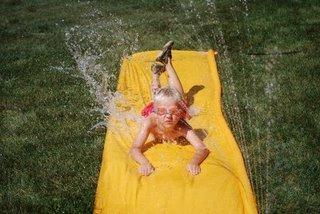 jared playing on slip'n slide