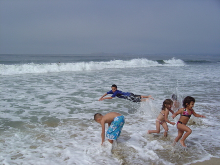 Grandchildren escaping waves