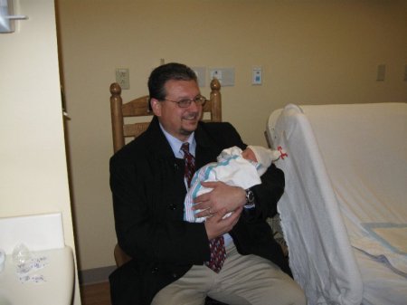 my husband with first grandchild EVA