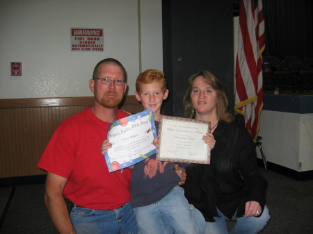 Chris receiving an award at school