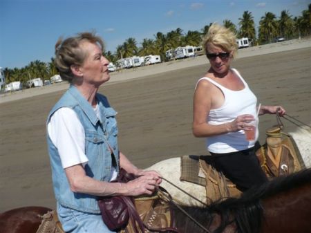 Me and Aunt Margie riding horses along the beach in Mexico