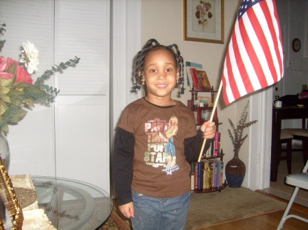 Kayla holding the American flag