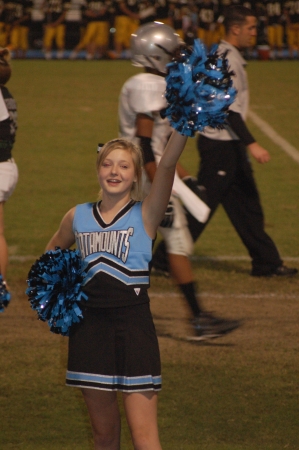 Lindsey cheers for the home team.