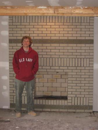 Ryan and fireplace that he built