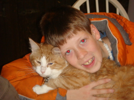My son Nick holding our cat Marmalade