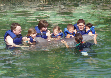 Swimming with dolphins at Xcaret