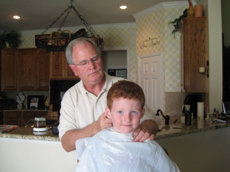 John cutting Sam's hair