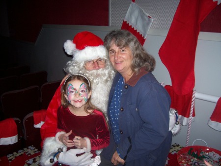 granddaughter, Zoni, me and Santa - 2009