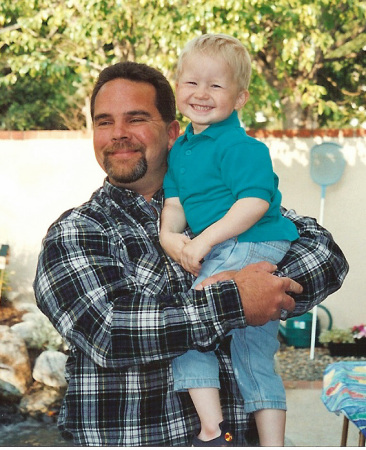 My brother Martin holding my oldest boy