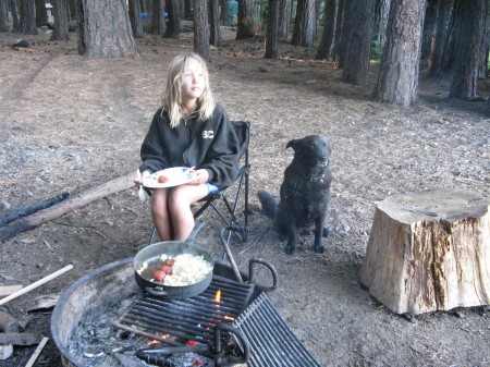 my daughter and dog on a camping trip
