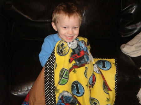 Grandson, Ethan, with new quilt