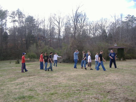 Sons and grandkids playing football in the f