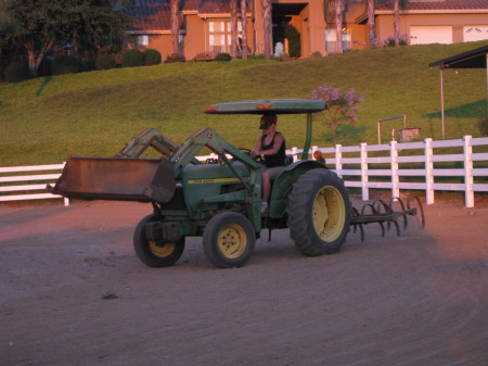 Our daughter, Amy working at our barn