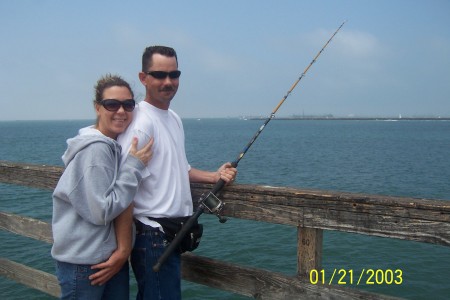 me and my husband fishing off of the pier