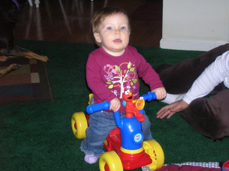 Lyla riding her scooter