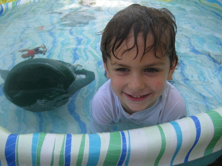 Swimmimg in his pool