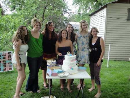 7 granddaughters helping with the cake