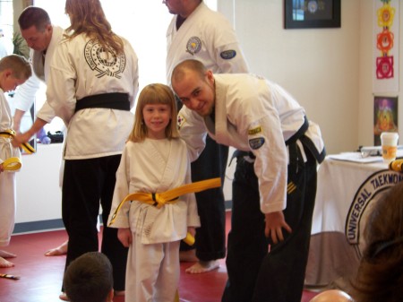 Jelli gets yellow belt w/black stripe 03/09