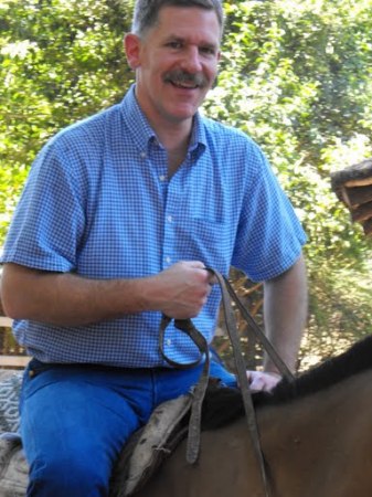 John riding at gaucho estancia